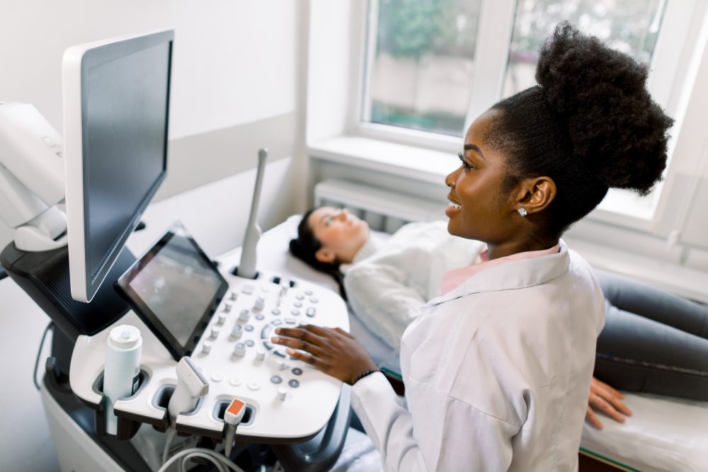 nurse giving a young woman an ultrasound